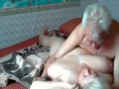 An elderly couple's passionate on-camera sex in their bedroom